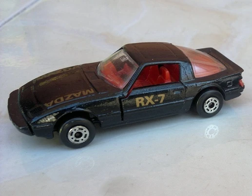 Mazda RX7 (Black, Gold "RX-7" on doors, "MAZDA" on the hoo…)
