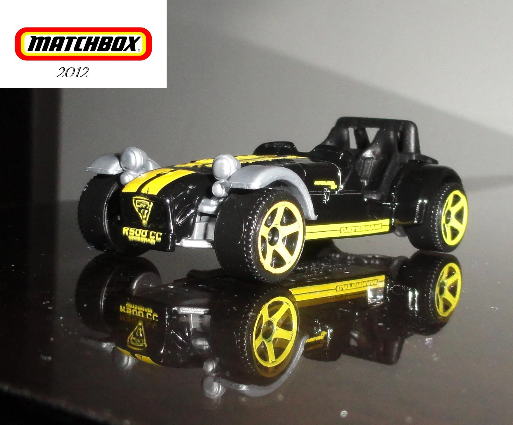 Caterham Superlight R500 - 2009 (Black, Yellow stripes, Caterham)