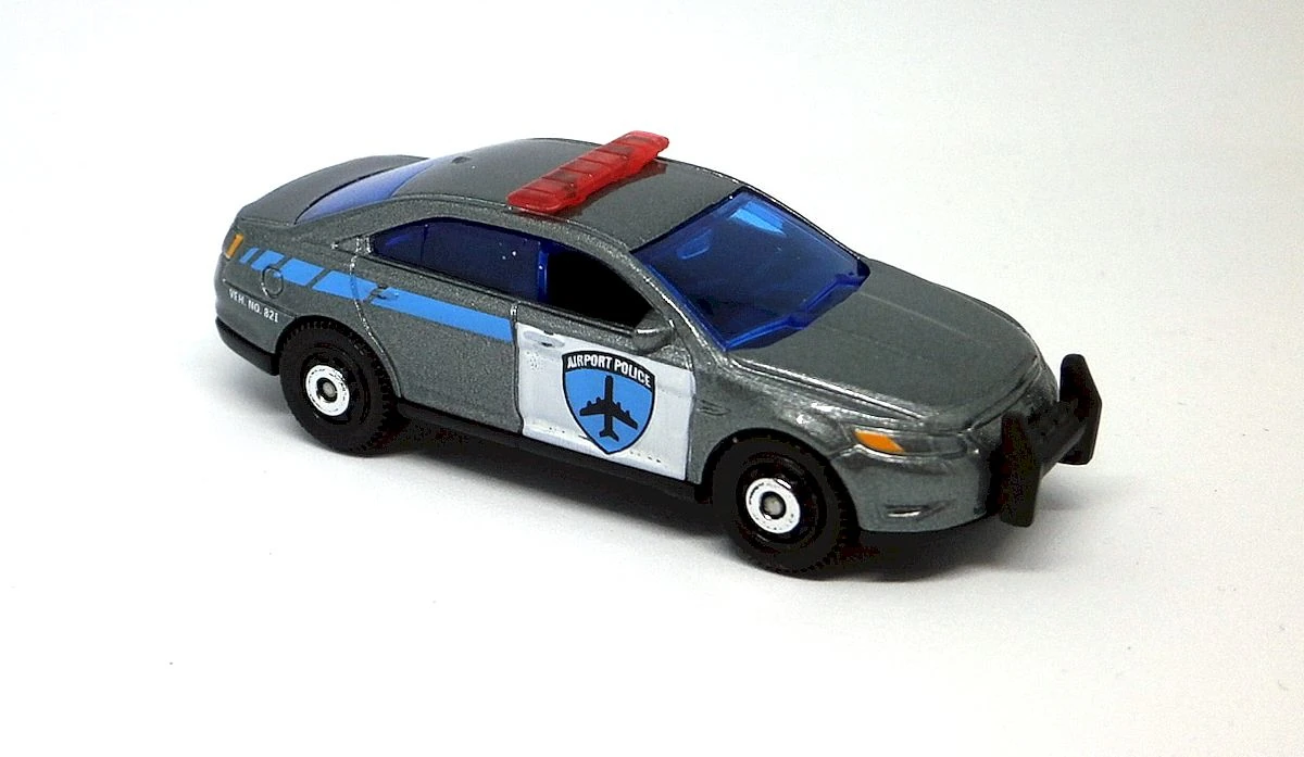 Ford Police Interceptor (Grey, Airport logos on sides, MBX Airport Poli…)