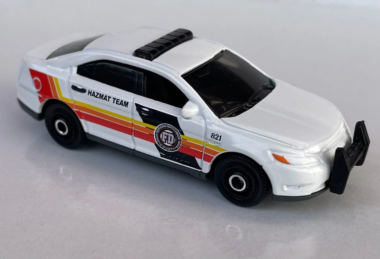 Ford Police Interceptor (White, Orange, yellow & black side stripes, 'HA…)