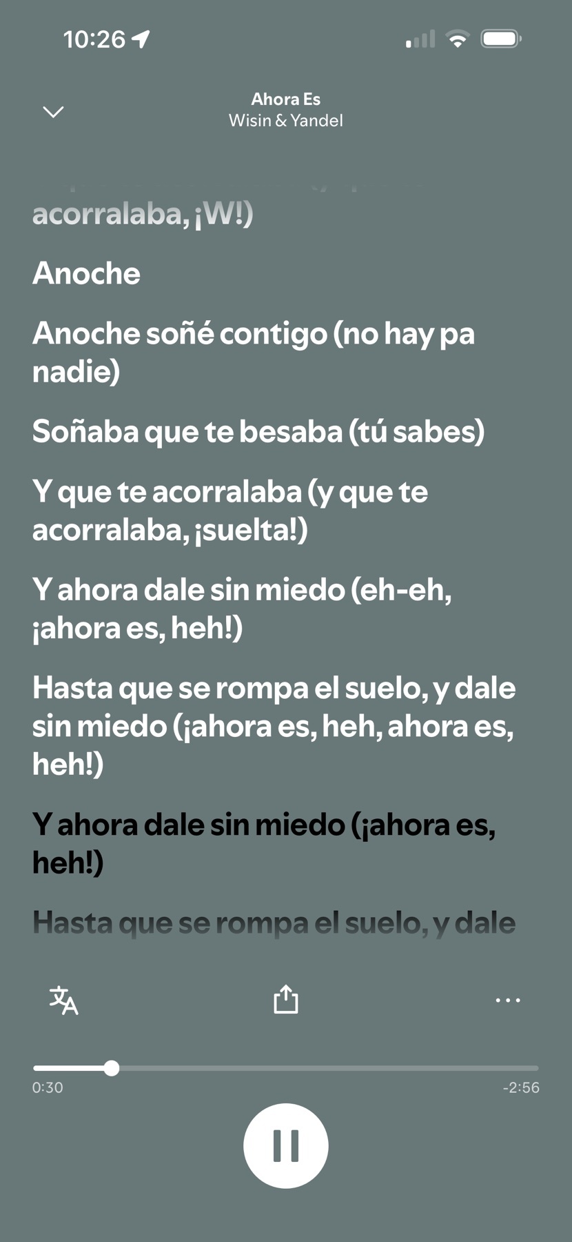 A screenshot of a music streaming app displays the lyrics to the song "Ahora Es" by Wisin & Yandel. The lyrics are presented in Spanish with a dark gray background and white text.