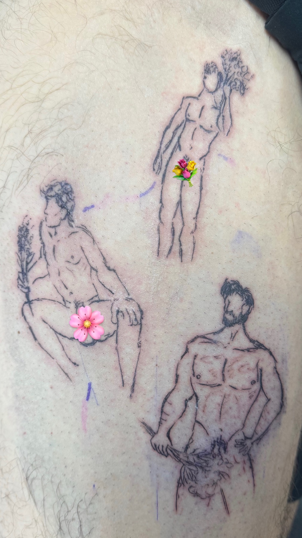 A tattoo of three male figures in a surreal style. Each figure is partially nude and adorned with flowers.