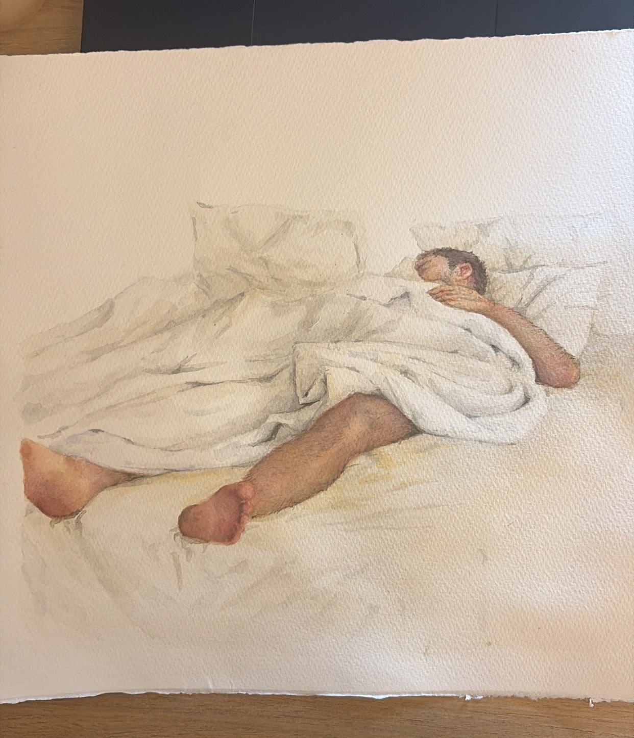 A watercolor painting depicts a man sleeping in a bed, covered by white sheets and blankets. His legs are exposed, and one arm rests on his chest.