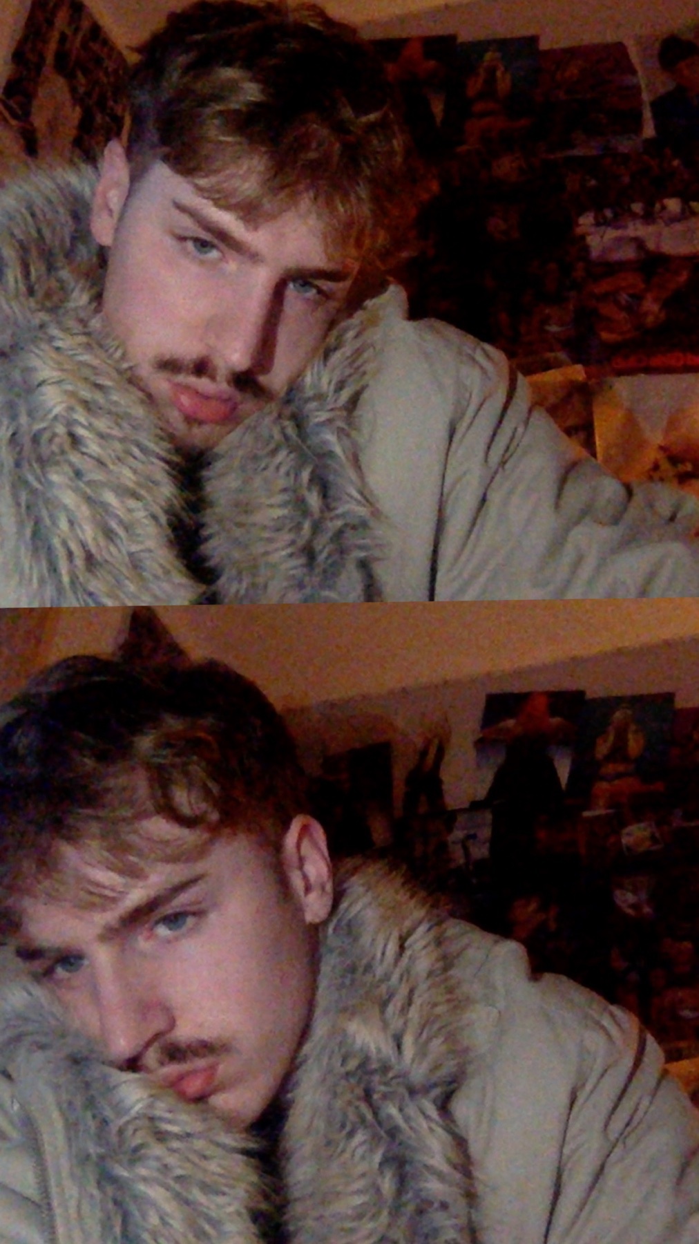 A man poses for a selfie, showcasing his curly hair and facial hair. He wears a jacket with a fur collar.