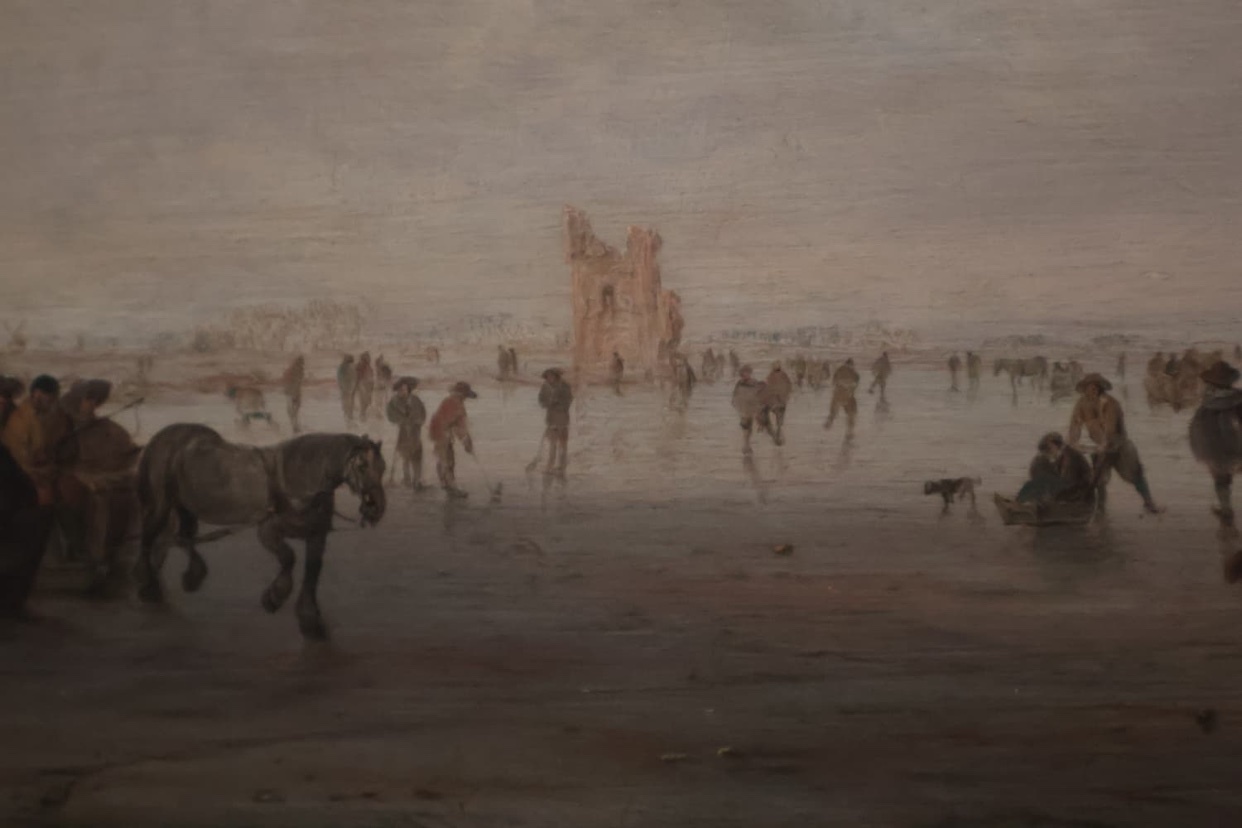 A historical oil painting depicts a bustling winter scene on a frozen body of water. People are ice skating and riding in a horse-drawn carriage, with a ruined building visible in the background under a cloudy sky.