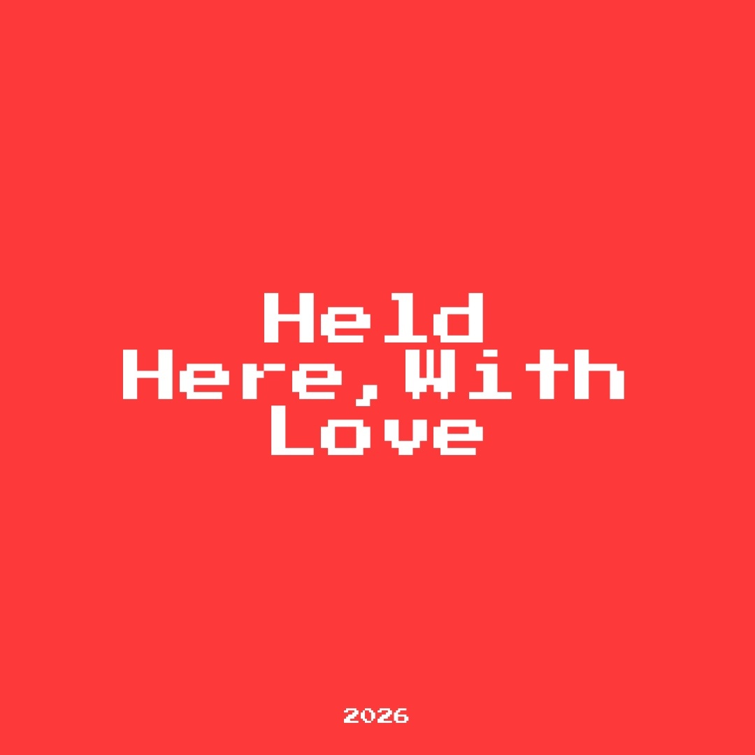 A red background with white pixelated text that reads "Held Here, With Love" and "2026" at the bottom.