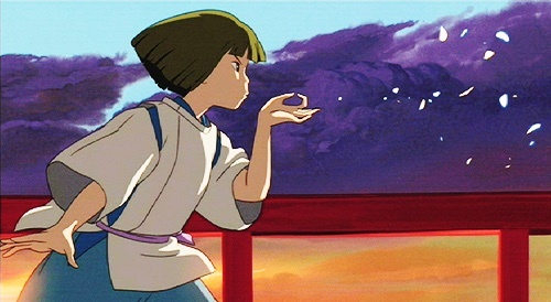 An animated illustration from the movie Spirited Away. Chihiro is blowing petals into the air.