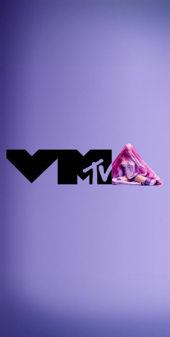 A woman is partially obscured by a sheer pink veil, sitting next to the black MTV logo against a solid purple background.