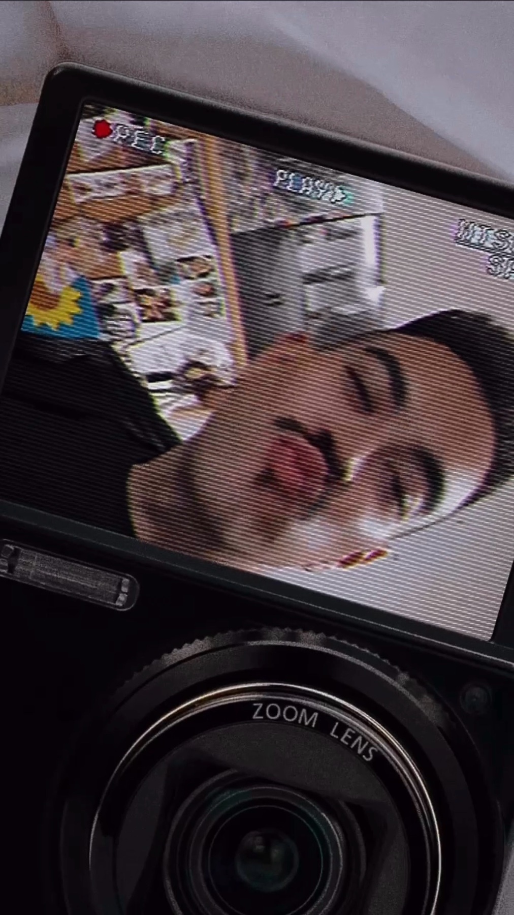 A selfie of a man making a kissing face. The photo is taken with a digital camera.