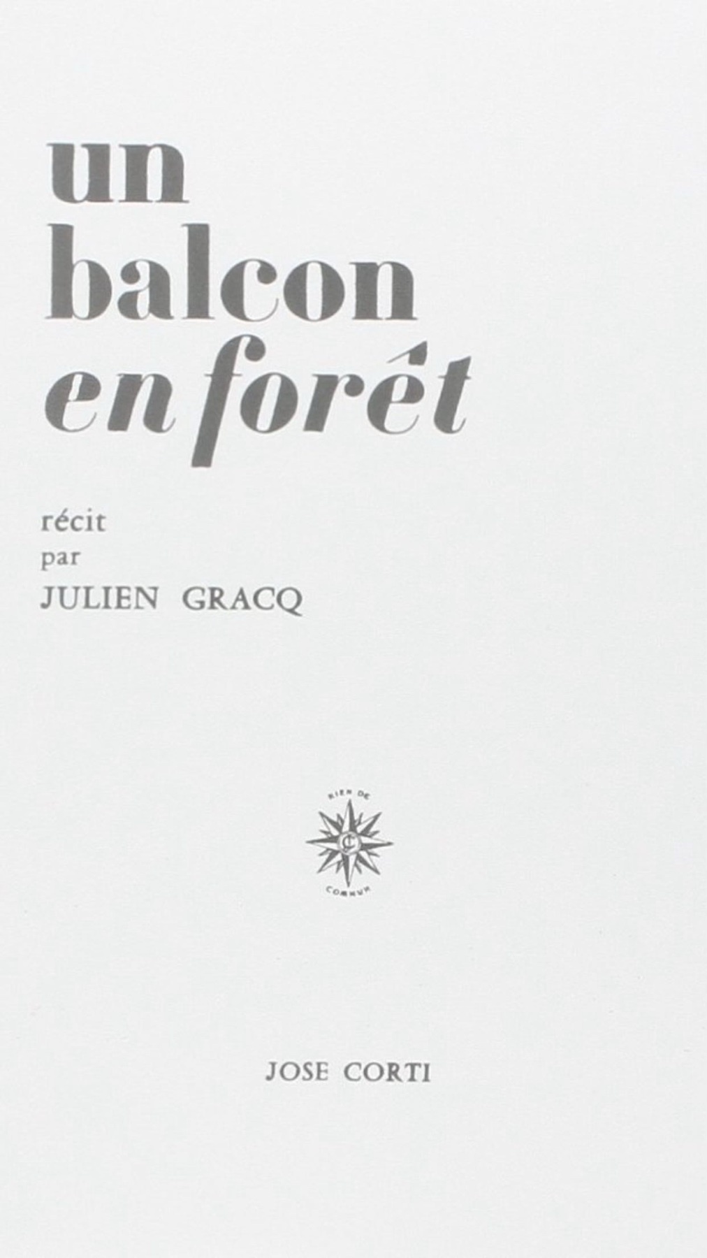 This is a minimalist book cover for 'Un Balcon en Forêt' by Julien Gracq. The title and author's name are displayed in a simple, elegant font against a light grey background. A small, stylized compass rose emblem is centered below the author's name,
