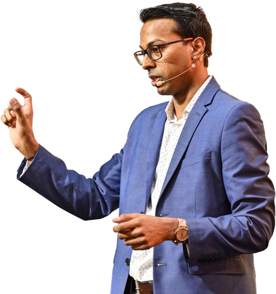 a man wearing a blue suit and microphone
