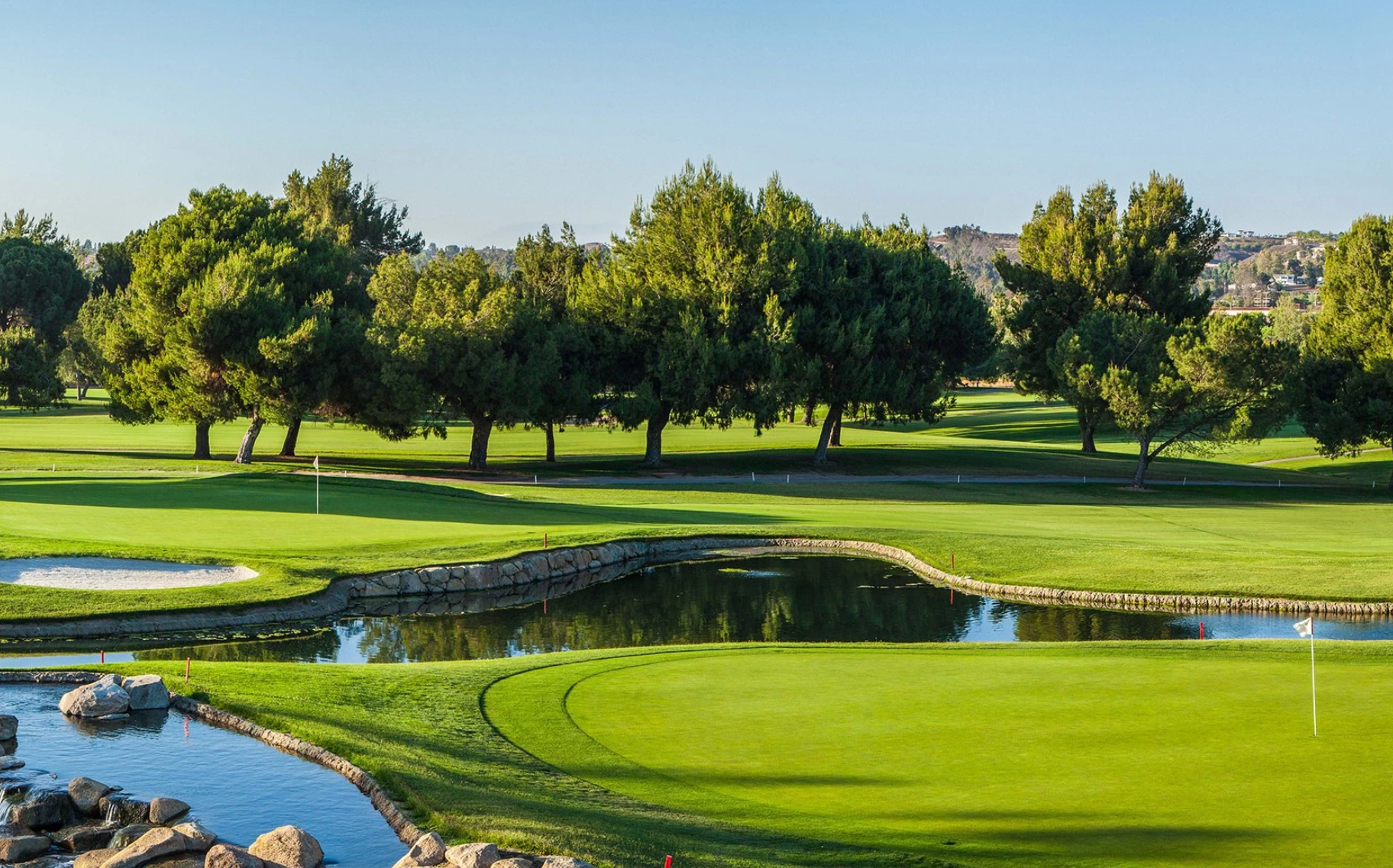 Green fairway and water hazard on a golf course in the Temecula Valley, California