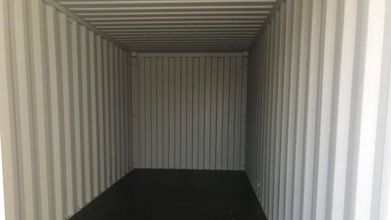 Interior view of a 40-foot storage container with the corrugated Corten steel walls visible