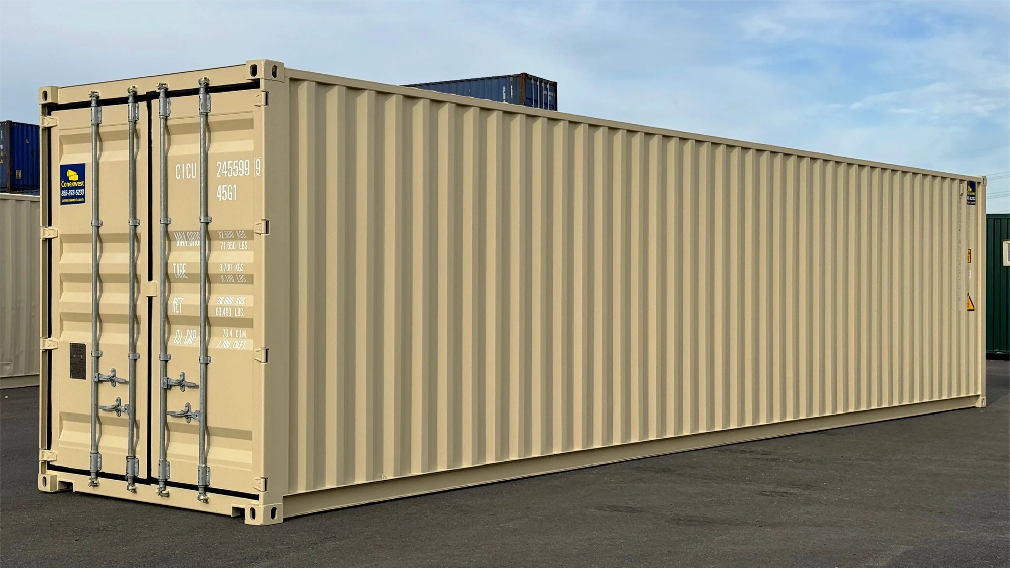 Finished beige 40ft shipping container with custom side access openings positioned outdoors