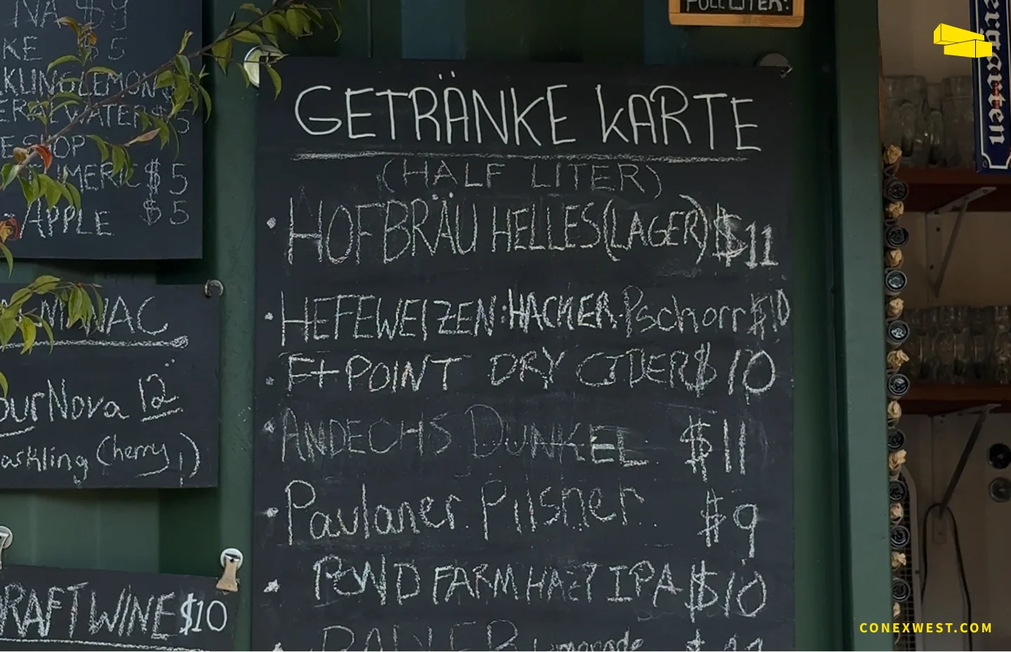 Detailed view of Biergarten’s drink menu displayed on the container wall