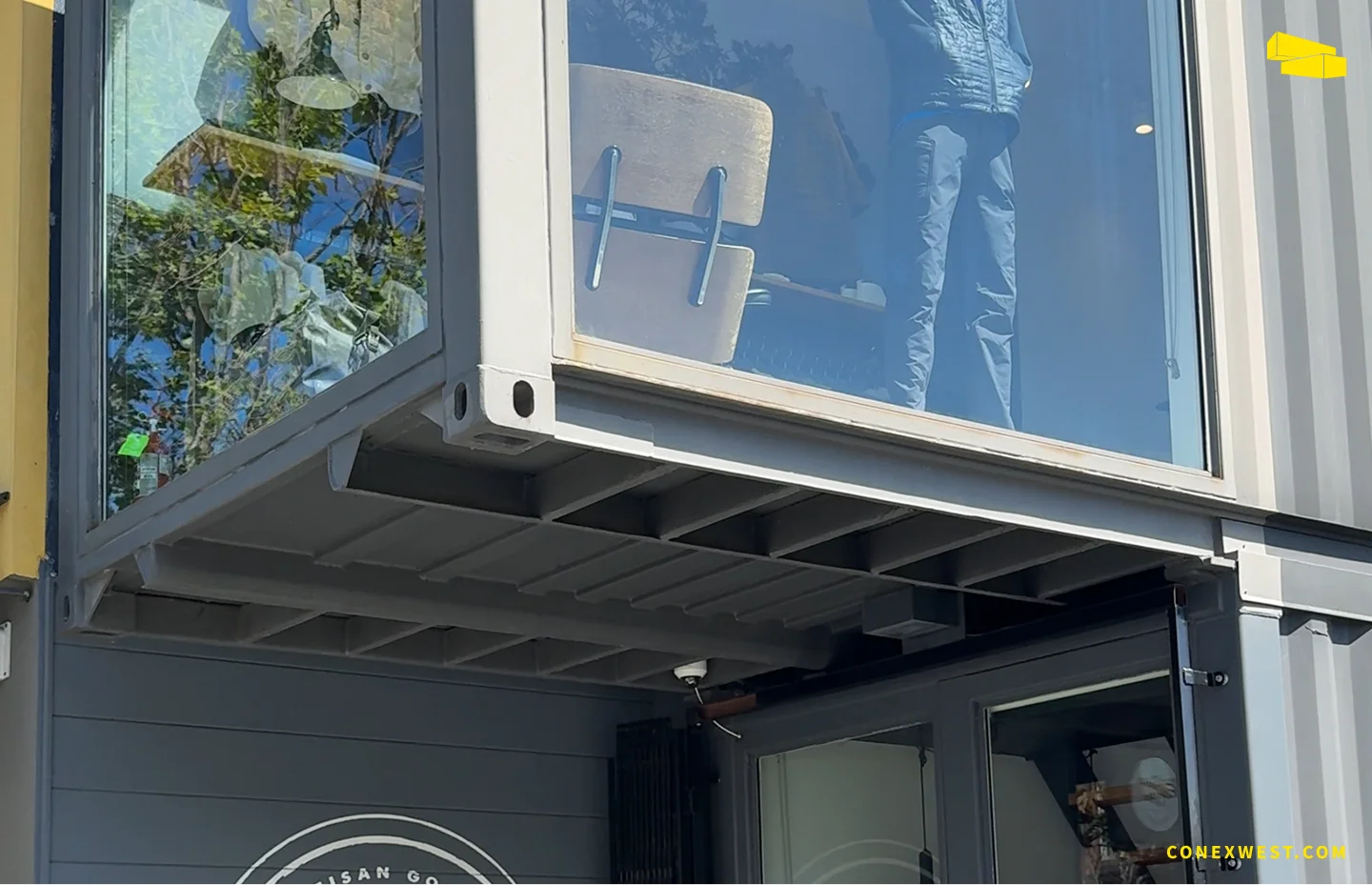 AETHER Apparel shipping container store three-story structure