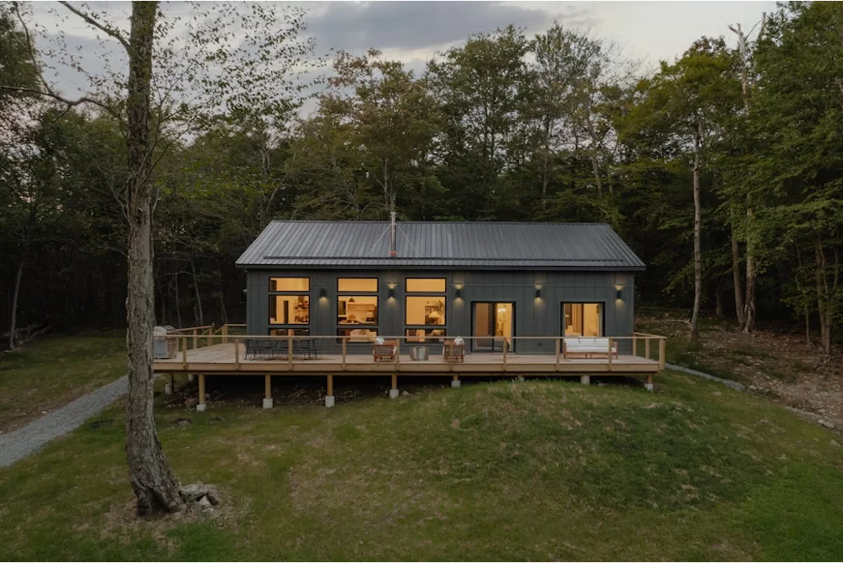 A container home in the forest.