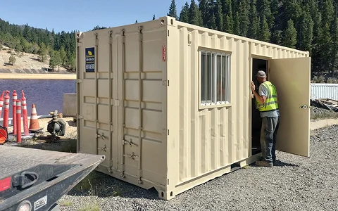 Construction job site storage container with worker entering