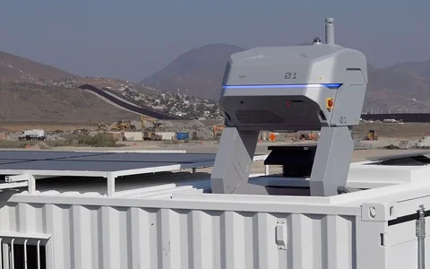 Container with equipment mounted on top in a desert setting