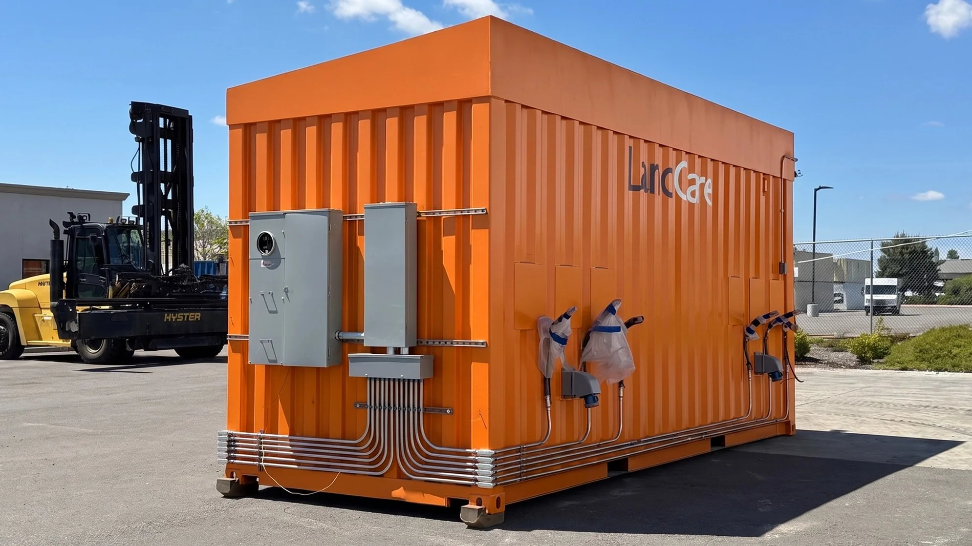 20ft orange shipping container mobile charging station at the yard