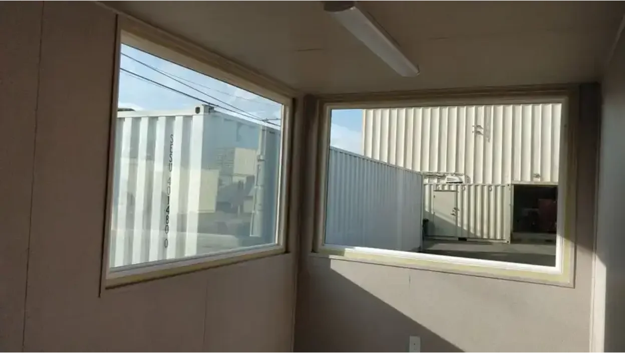 Double-pane picture window for shipping containers.