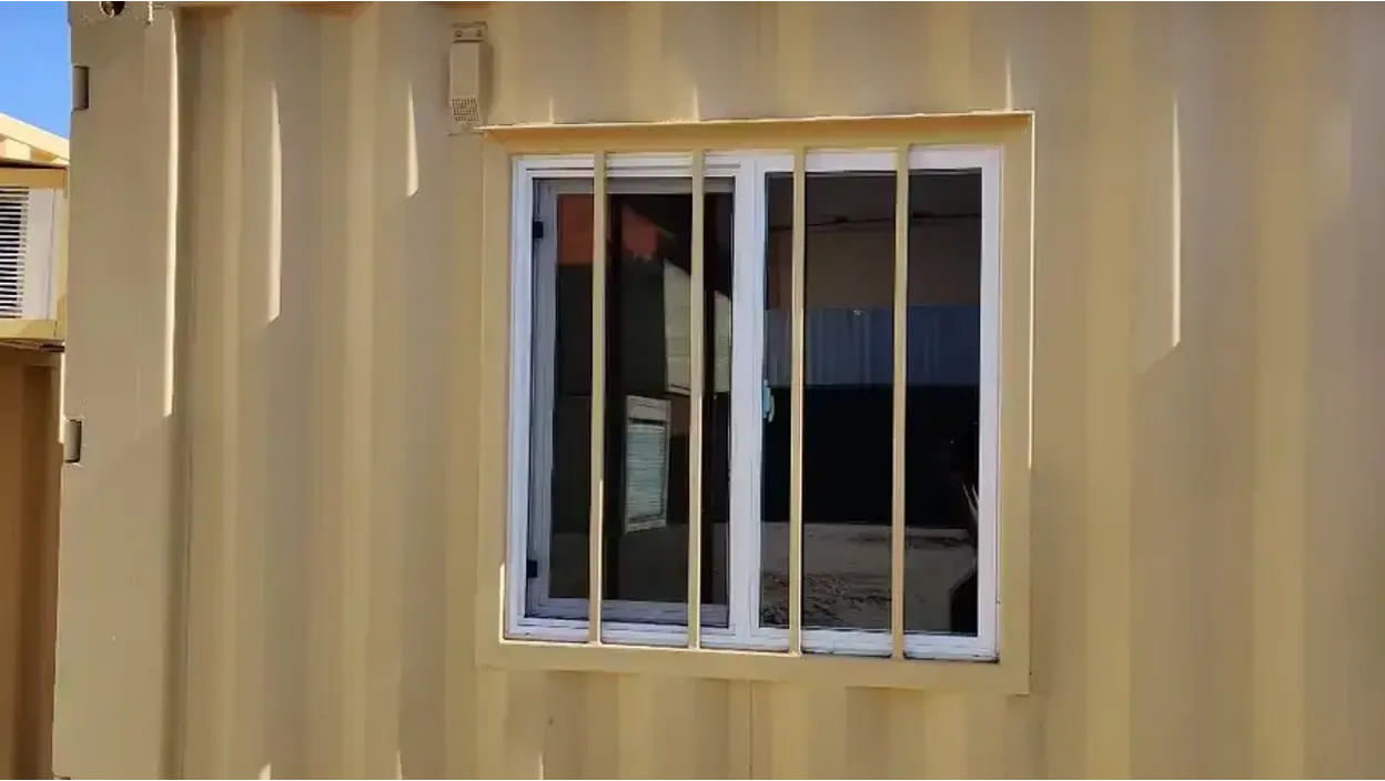 Double-pane sliding windows for shipping containers.