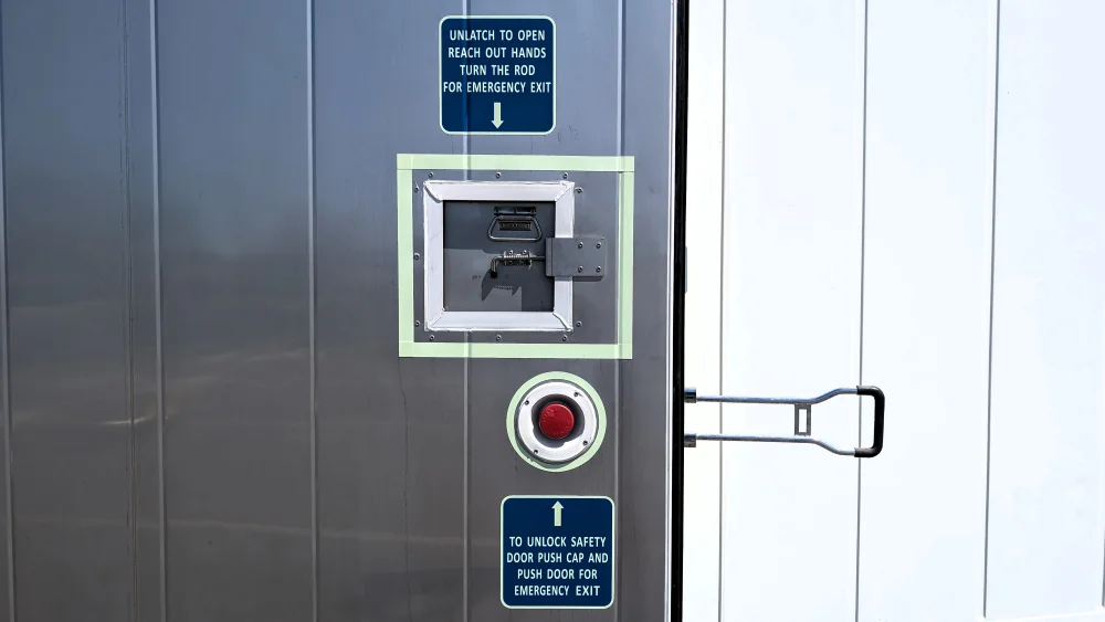 Emergency exit for refrigerated containers