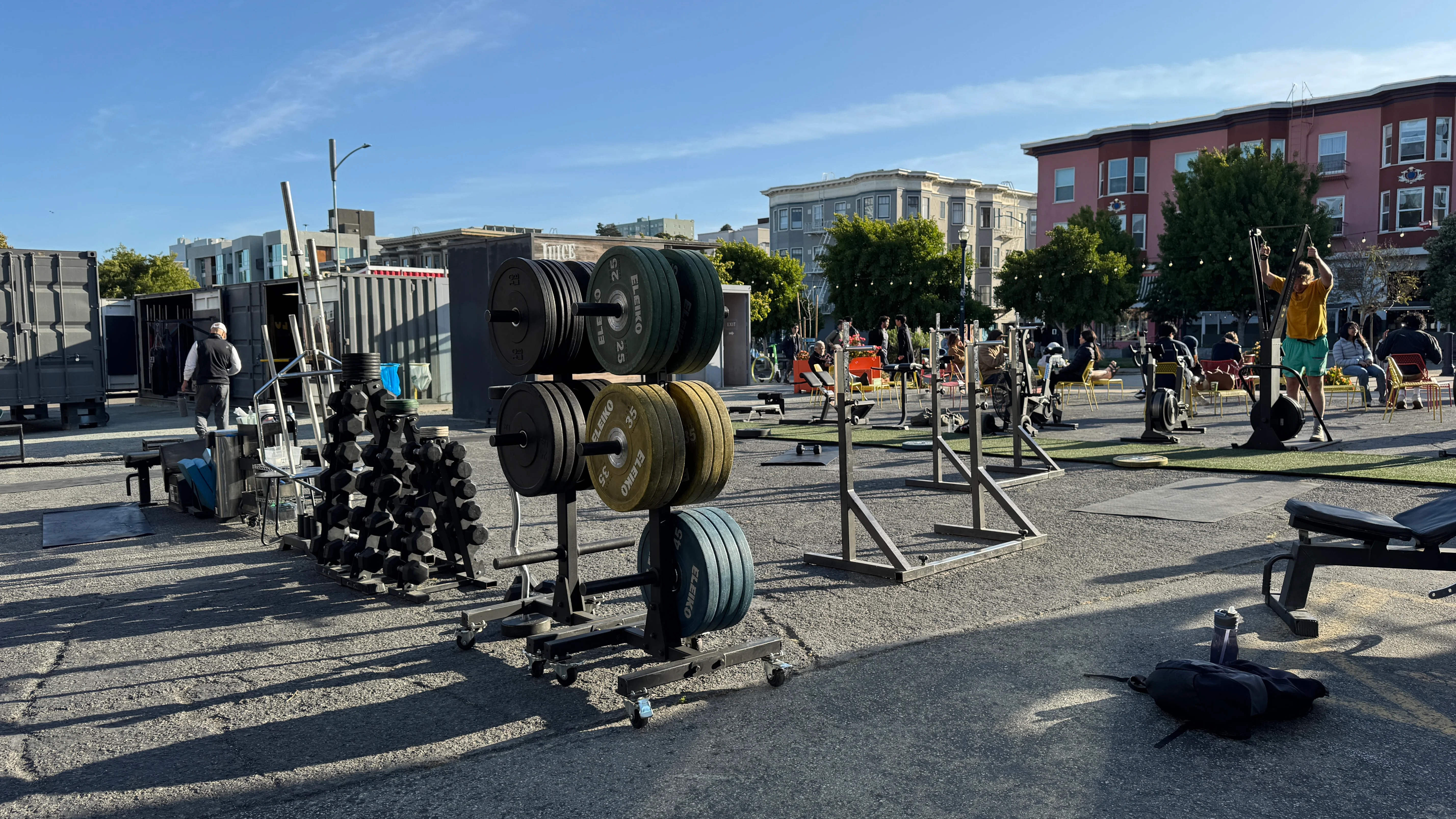 Outdoor workout area at LuxFit with modified shipping containers and fitness equipment