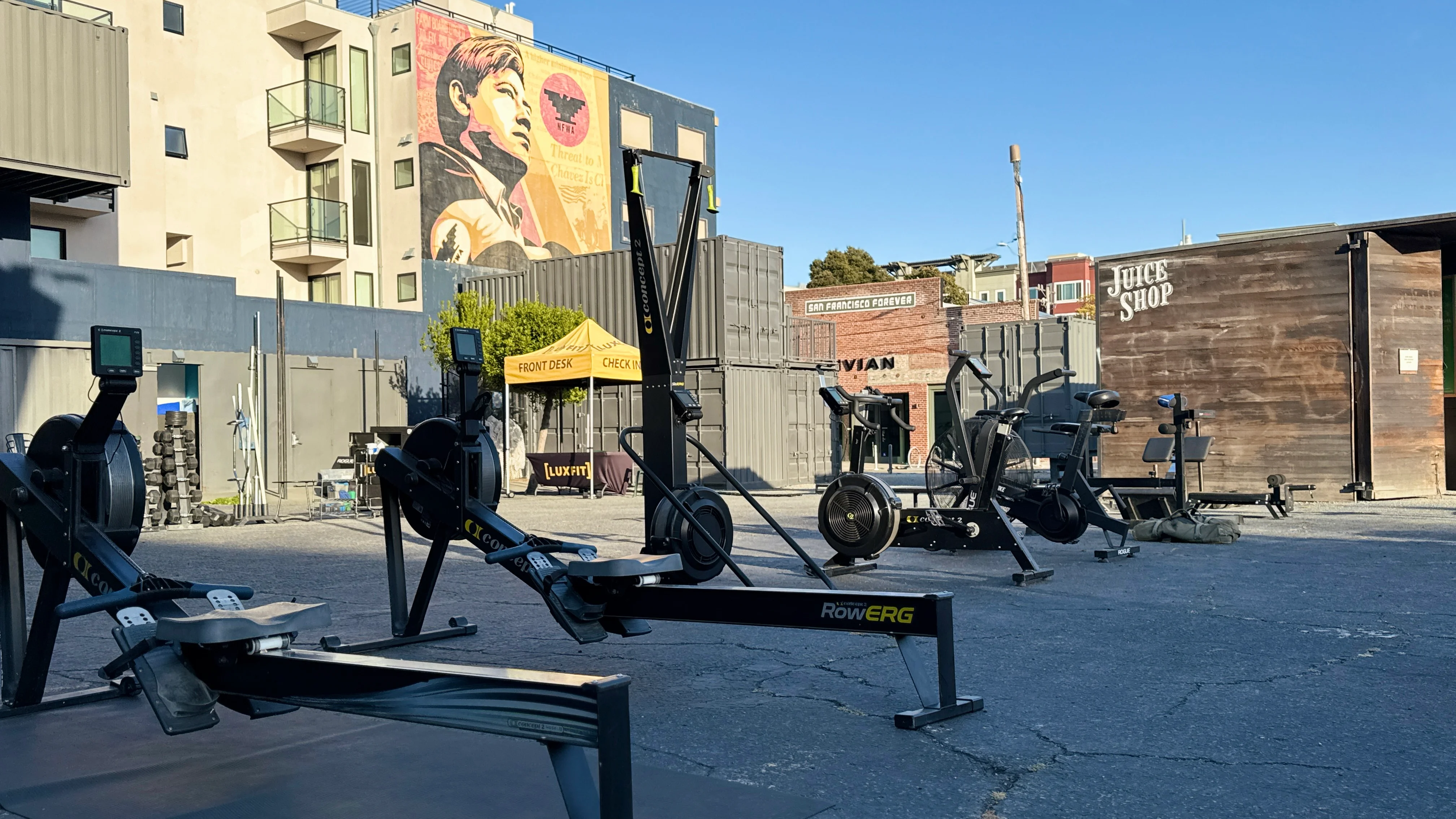 LuxFit container gym training area with fitness equipment in an open-air San Francisco plaza