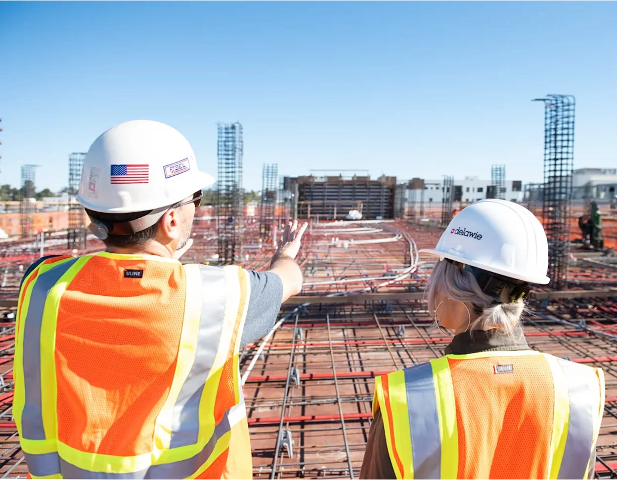 Two building inspectors reviewing construction