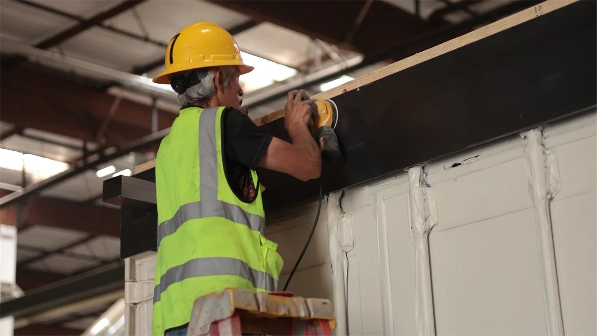 Worker installing interior