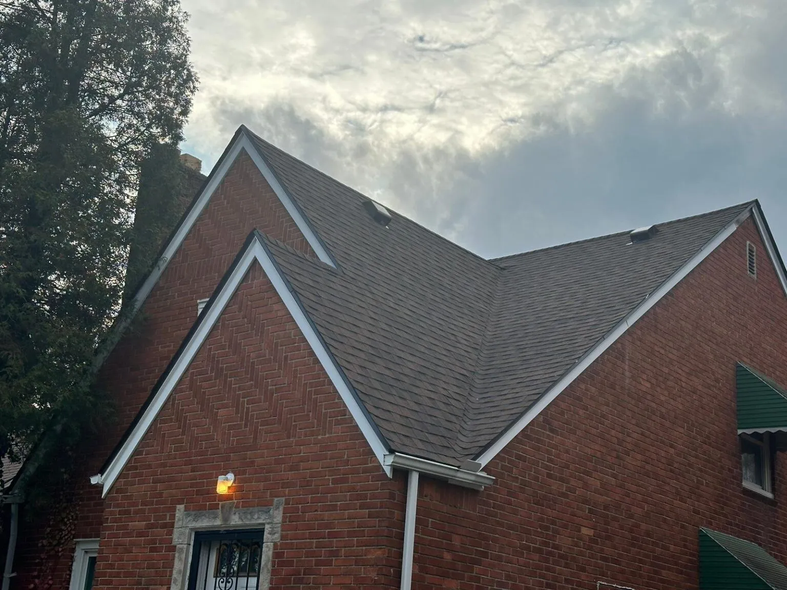 Residential roof with storm damage that needs inspection