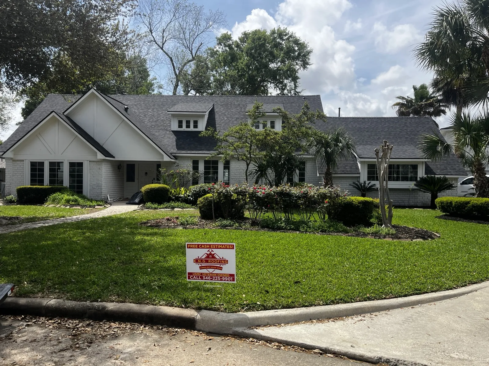 Homeowner inspecting hail damage on a roof, emphasizing the claims process for roof insurance