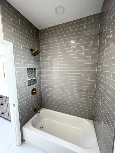 Stylish modern bathtub in a renovated bathroom, highlighting features and contemporary design