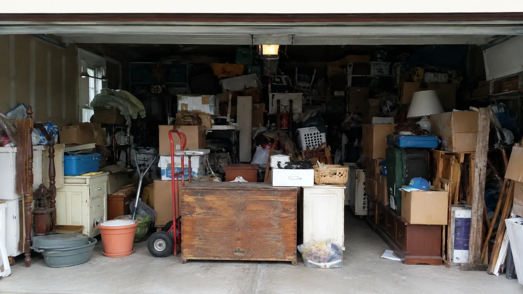 Packed garage full of household belongings before an estate cleanout in Wicomico County MD