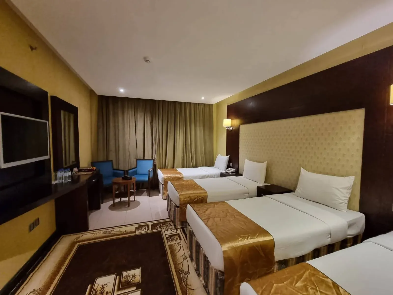 Travelers preparing for Umrah in Riyadh, showcasing excitement and cultural diversity