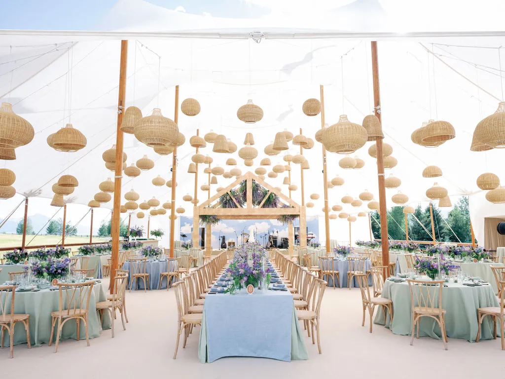 Outdoor holiday bash featuring a spacious luxury event tent
