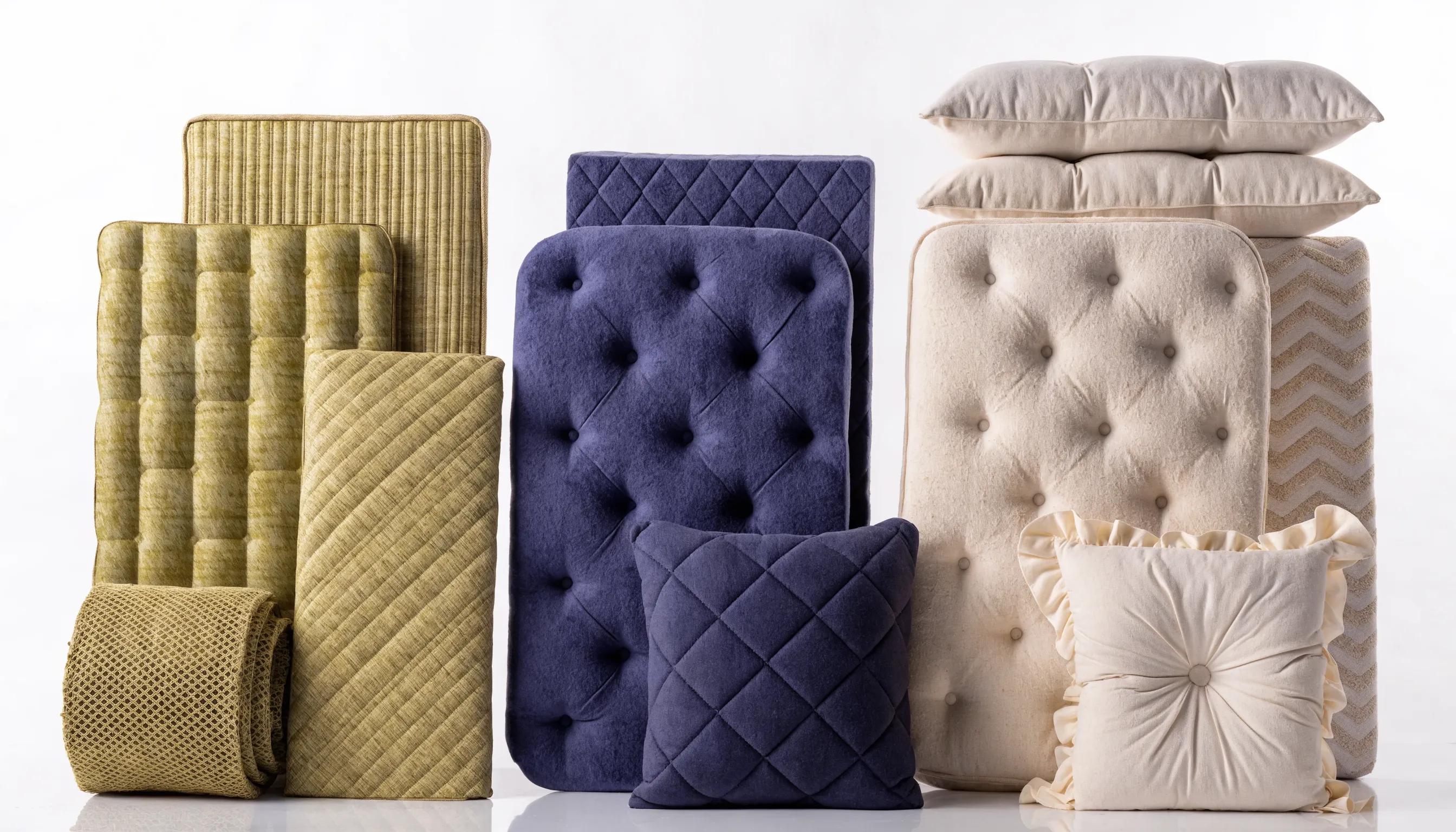 Comparison of bamboo, memory foam, and latex mattress toppers showcasing their distinct textures and materials