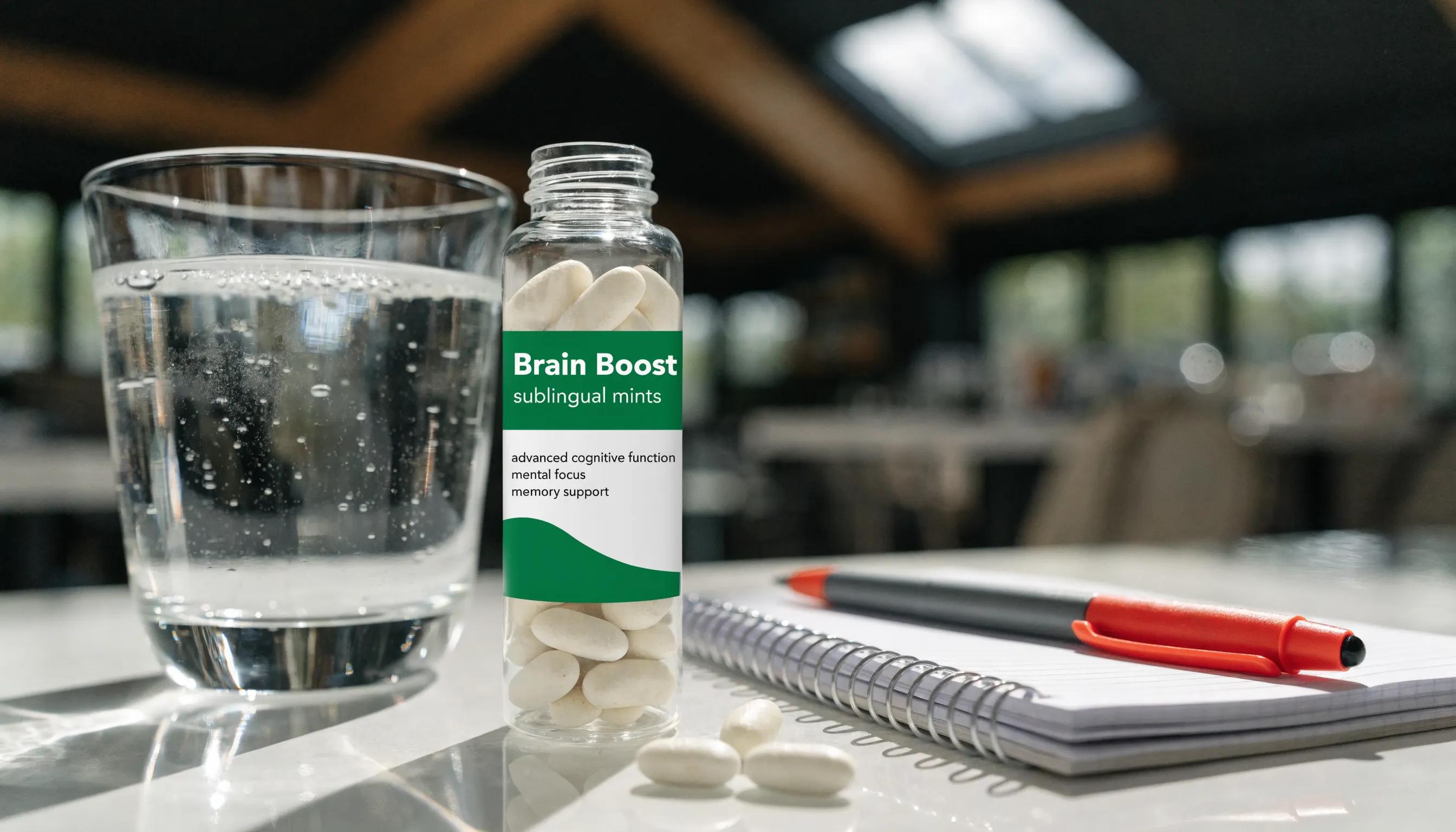 Clear glass of water and open sublingual mints on a clean surface, representing cognitive support and hydration
