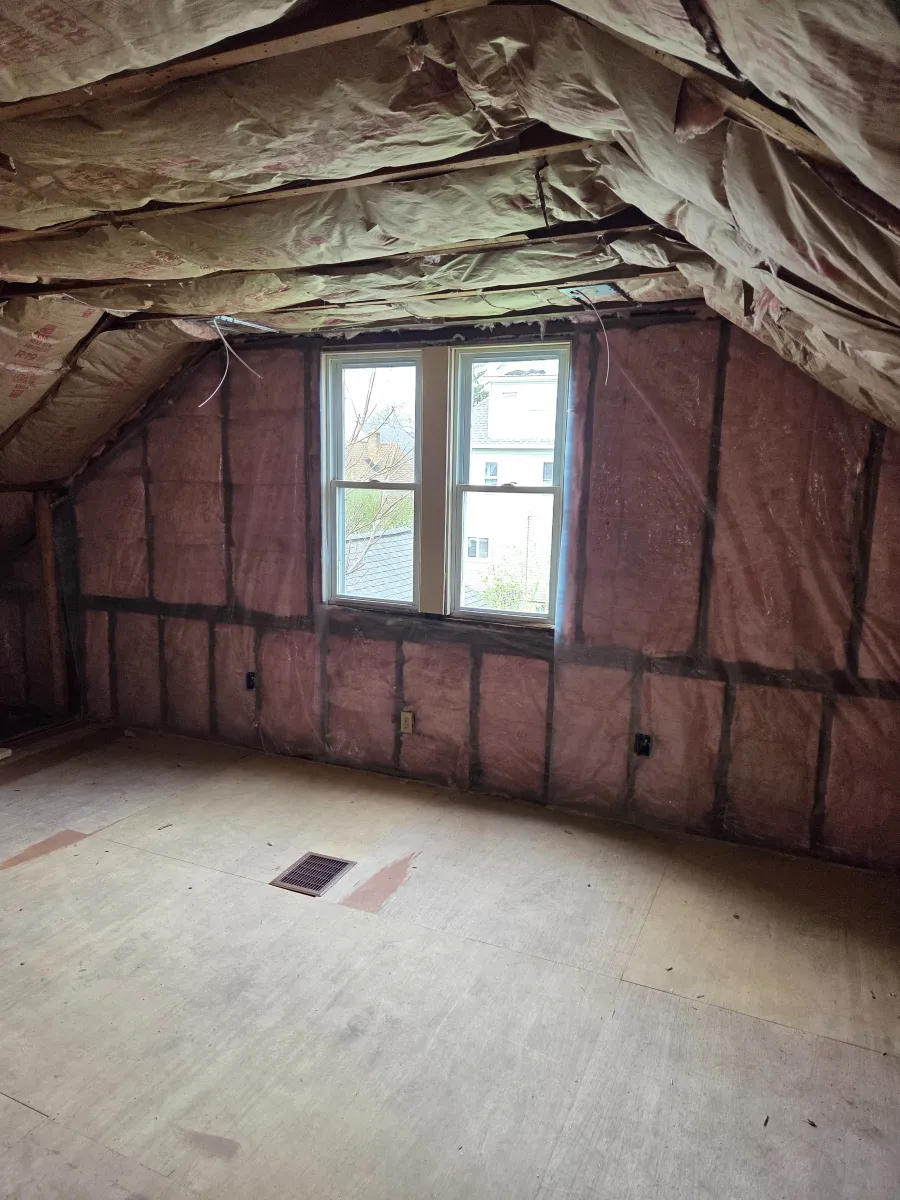 Diagram illustrating various types of insulation within a home, including attic, wall, and floor insulation, highlighting areas for energy efficiency improvements.