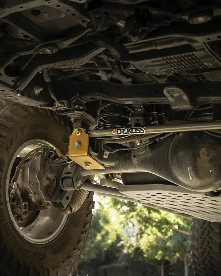 Mechanic conducting hydraulic cylinder repair on Lexus GX460, emphasizing vehicle maintenance and upgrades
