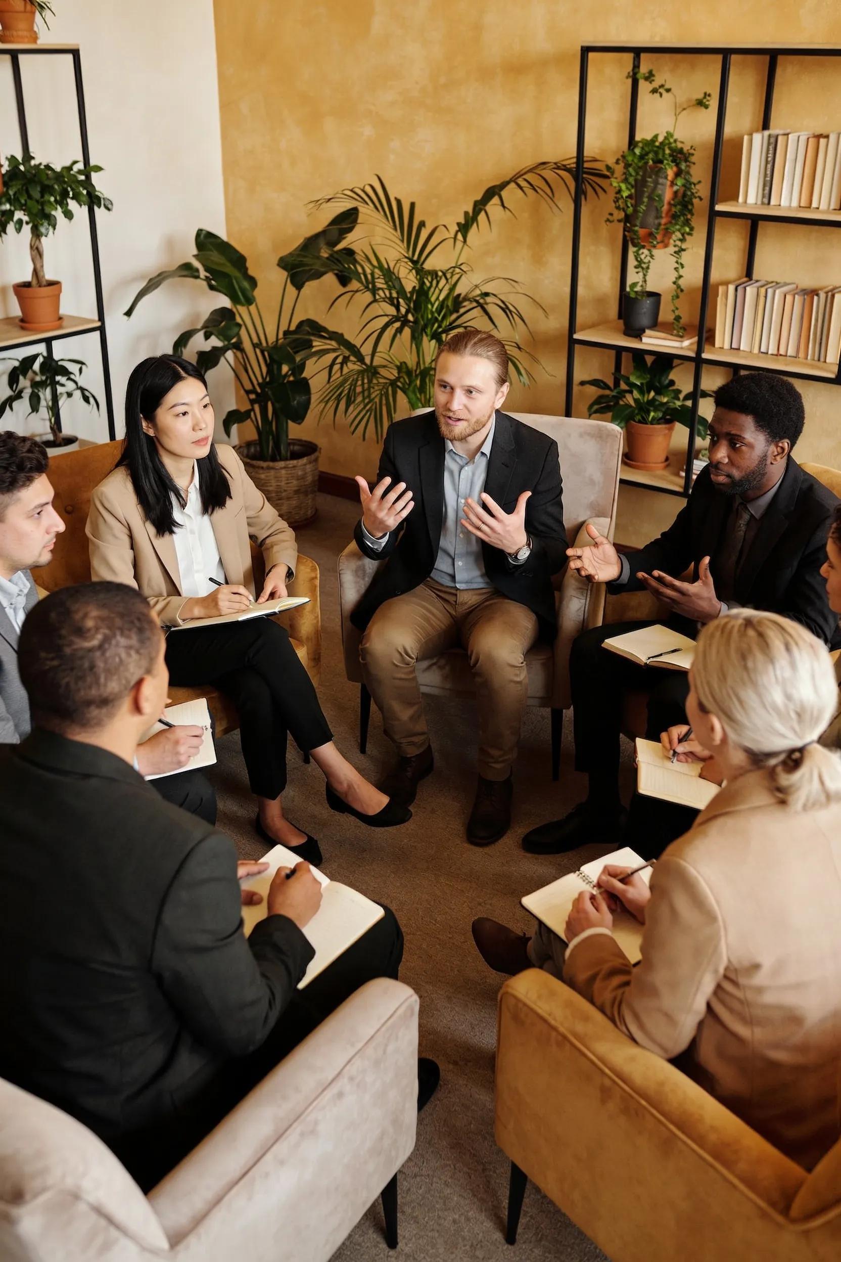 Coaching session with diverse professionals in a cozy, supportive environment