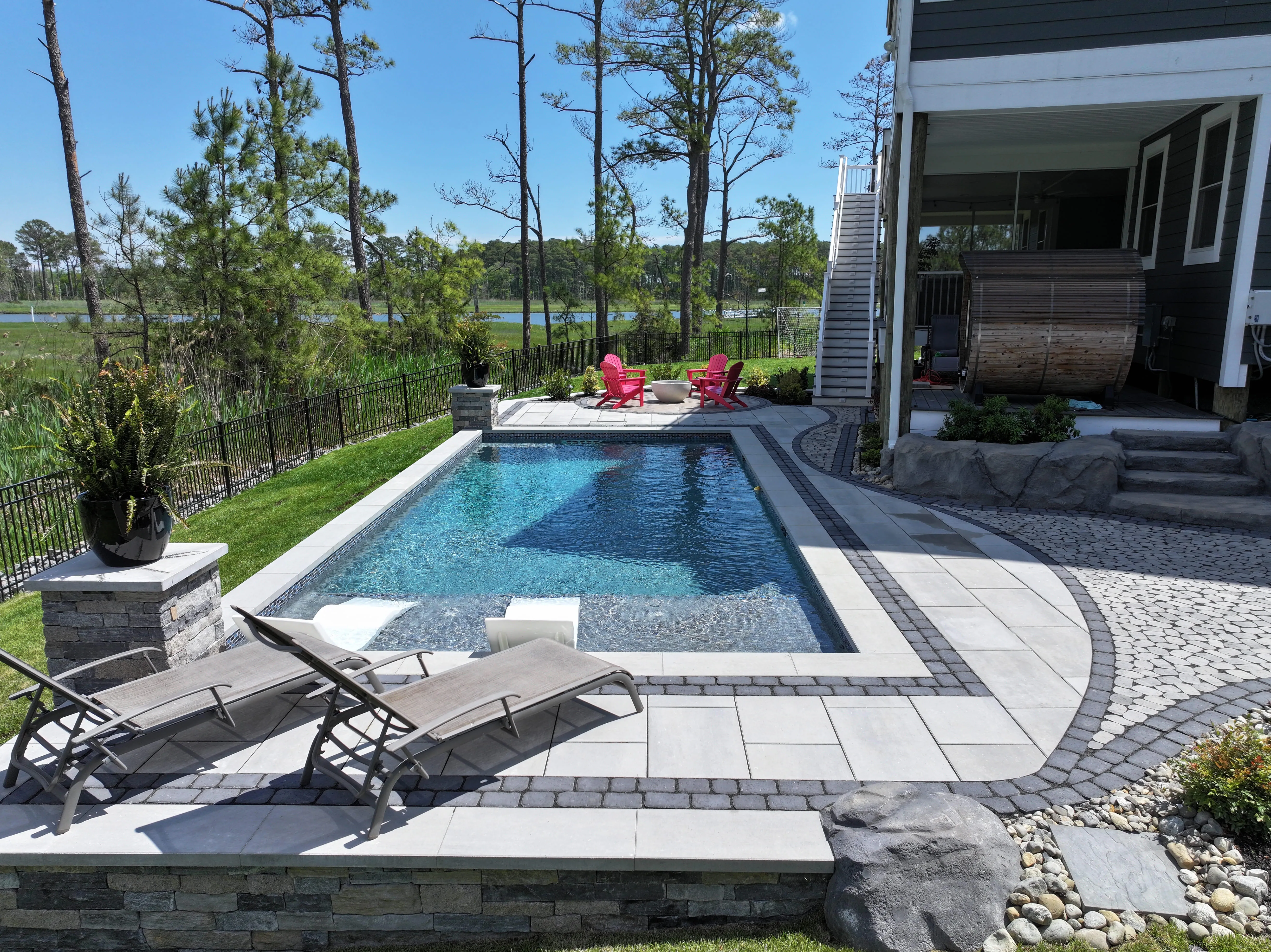 Completed inground gunite pool with paver deck in Sussex County Delaware