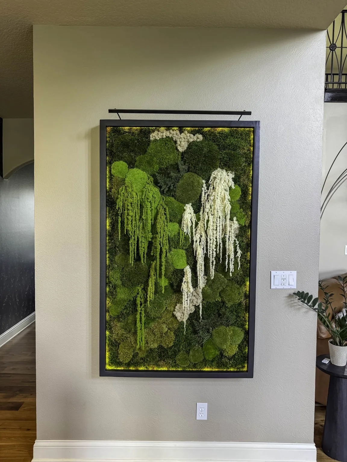 Close-up of preserved moss wall in a corporate environment, showcasing design integration and color harmony