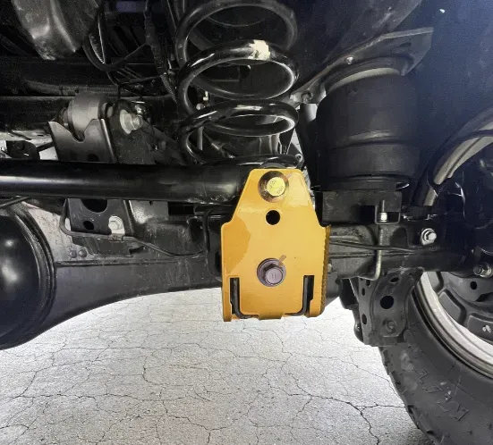 Hands installing KDSS correction kit components on Gen5 Toyota 4Runner, demonstrating the installation process.