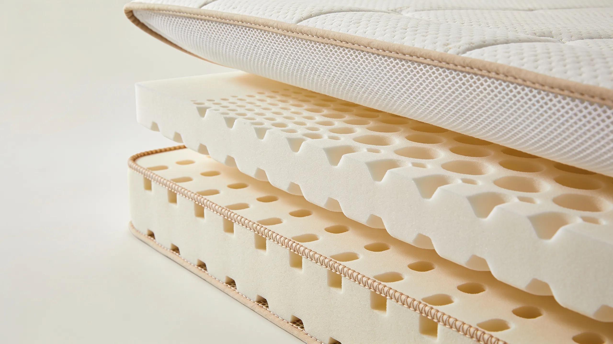 Detailed view of a foldable mattress showcasing memory foam layers and breathable fabric, emphasising comfort and quality