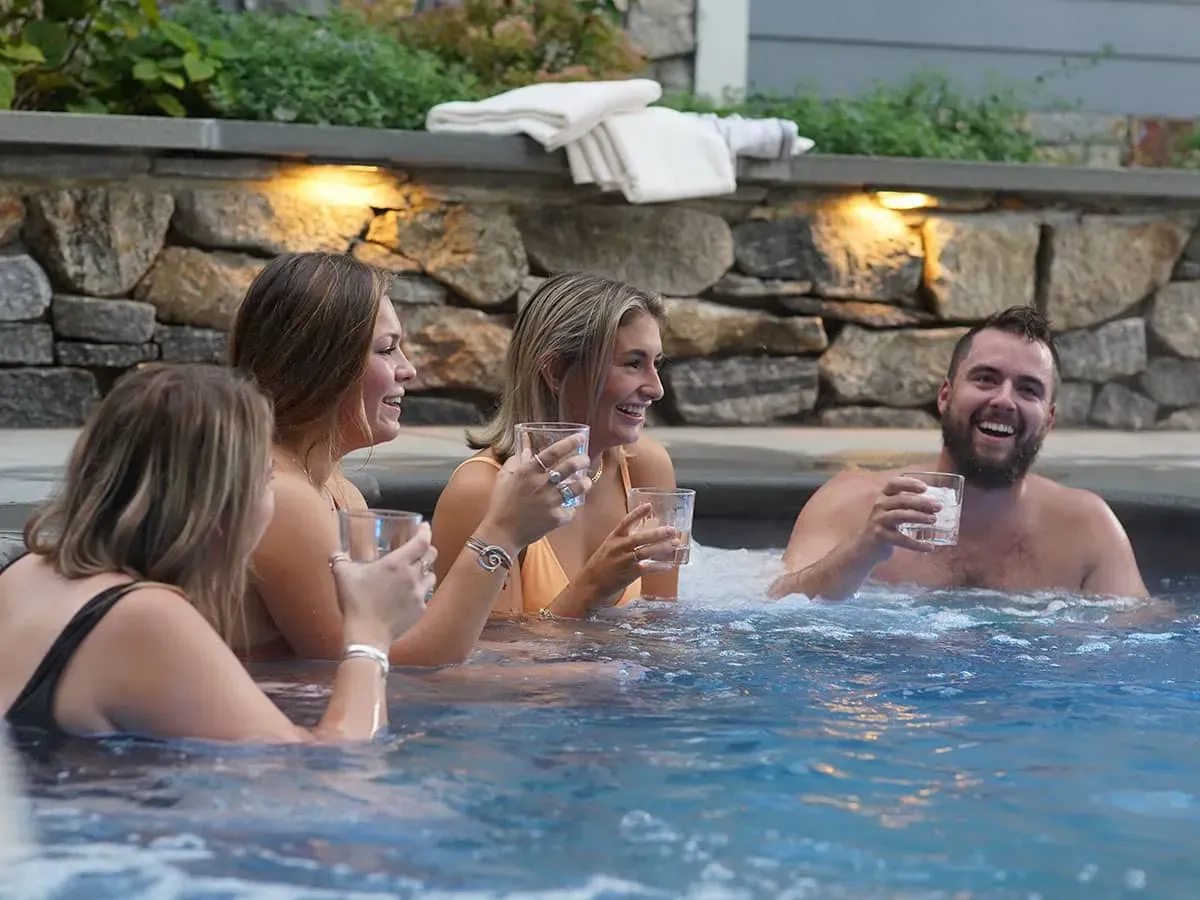Individual experiencing soothing hydrotherapy, highlighting the relaxation benefits