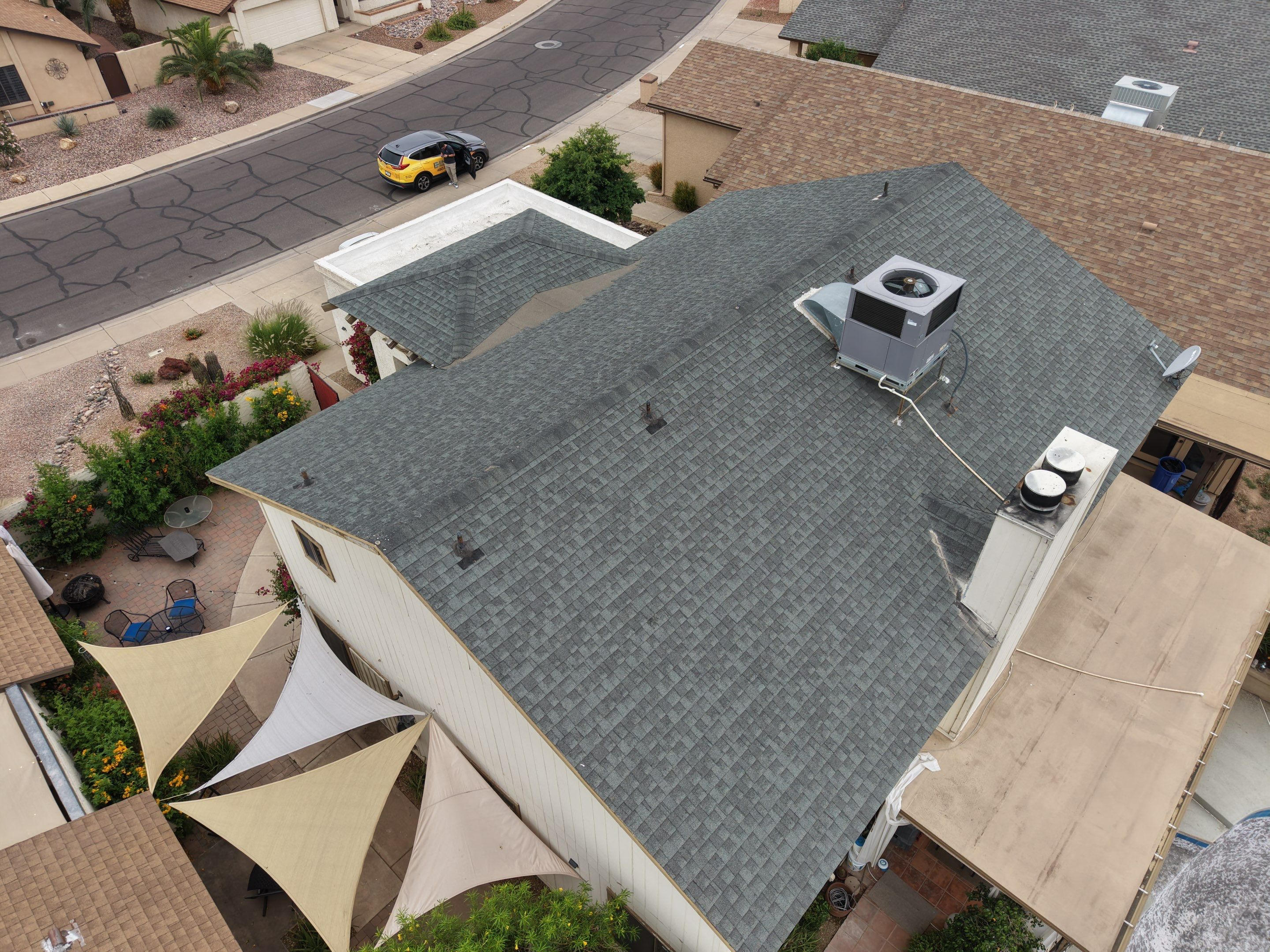 Before: damaged shingles in Mesa, AZ