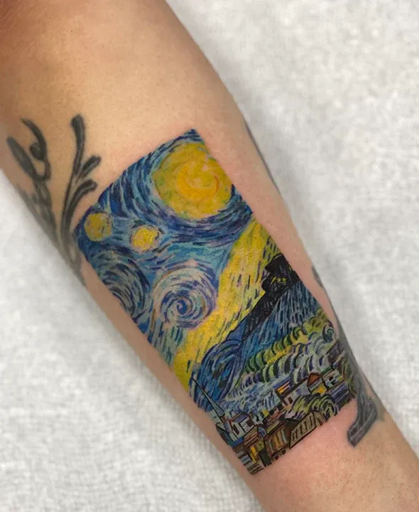Micro-realism color tattoo reproducing Van Gogh's The Starry Night on a forearm.