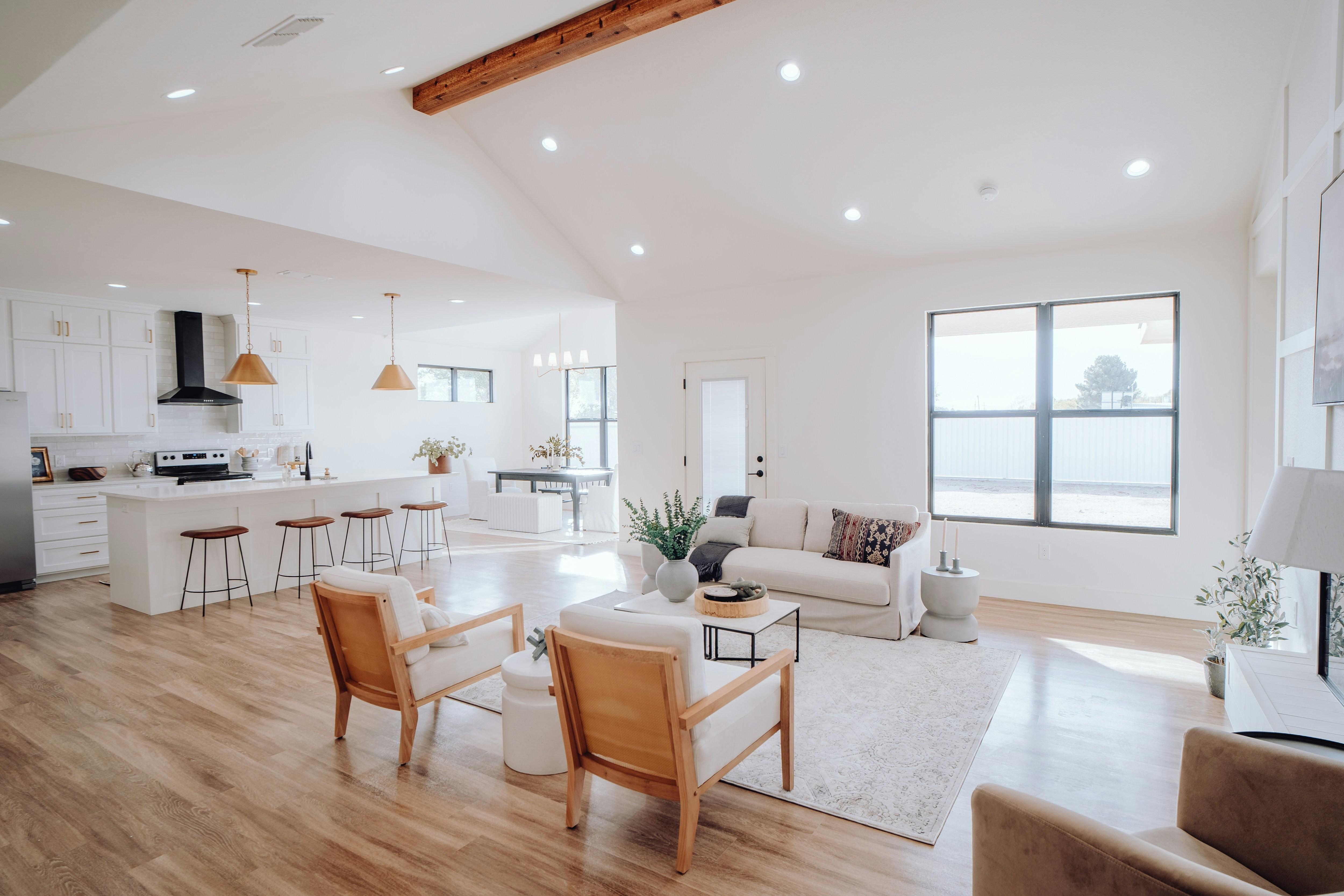 Homeowner reviewing builder testimonials on a tablet in a cozy living room